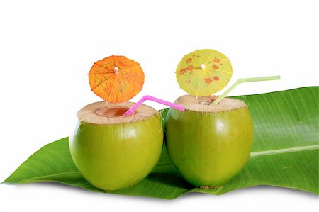 coconut beverage straw cocktail on banana leaf tender fresh coco isolated Stock Photo - Budget Royalty-Free & Subscription, Code: 400-04832905
