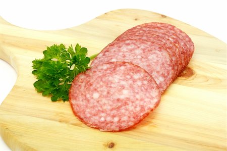 slices salami isolated on a white background Stock Photo - Budget Royalty-Free & Subscription, Code: 400-04833445