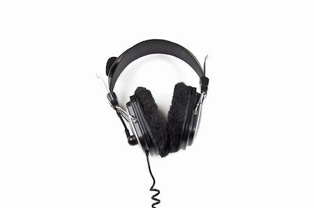 simsearch:400-04838289,k - man holding Headphones Isolated on a White Background Stock Photo - Budget Royalty-Free & Subscription, Code: 400-04833476