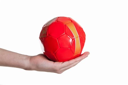 man holding red small football ball isolated Stock Photo - Budget Royalty-Free & Subscription, Code: 400-04833489