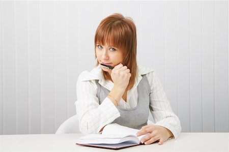 business attractive blue-eyed girl with a notebook and pen. Stock Photo - Budget Royalty-Free & Subscription, Code: 400-04833861