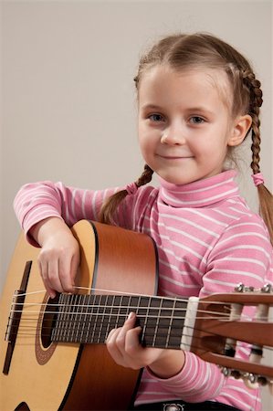 Young girl play classical guitar Stock Photo - Budget Royalty-Free & Subscription, Code: 400-04844148