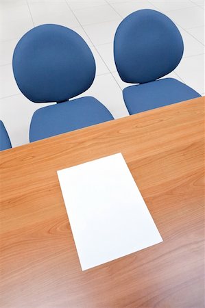 Office table with blank paper sheet on it and chairs. Stock Photo - Budget Royalty-Free & Subscription, Code: 400-04844212