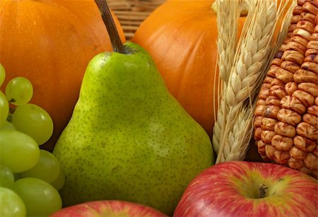 dry fruits crops - Green pear among other autumn harvest products, such as pumpkin, grapes, apples, corn and wheat (Selective Focus, Focus on the pear) Stock Photo - Budget Royalty-Free & Subscription, Code: 400-04844581