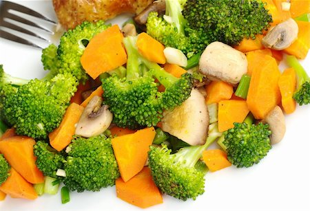 side dish with chicken - Fried vegetables (broccoli, mushroom, carrot, shallot) on white plate with a fork (Selective Focus) Stock Photo - Budget Royalty-Free & Subscription, Code: 400-04844614