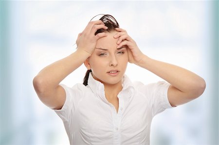 Young business woman with headache Stock Photo - Budget Royalty-Free & Subscription, Code: 400-04844992