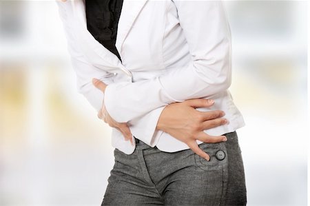 simsearch:400-06106822,k - Woman with stomach issues isolated on white background Stockbilder - Microstock & Abonnement, Bildnummer: 400-04845131
