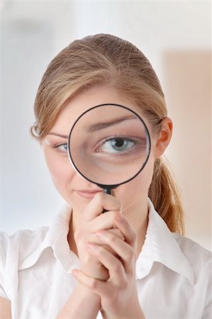 simsearch:400-04554899,k - The woman with a magnifier in a hand Stock Photo - Budget Royalty-Free & Subscription, Code: 400-04845132