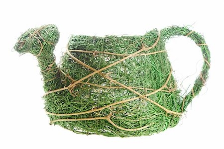 Braided from dried-up grass flowerpot in shape of watering can. Image isolated over pure white background. Stock Photo - Budget Royalty-Free & Subscription, Code: 400-04845460