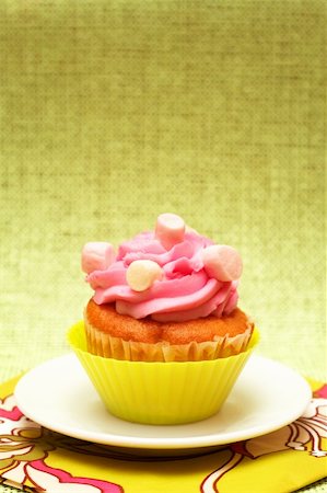 simsearch:400-05316582,k - Fresh vanilla cupcake in green cup with strawberry icing and marshmallows on decorative background Stock Photo - Budget Royalty-Free & Subscription, Code: 400-04845521