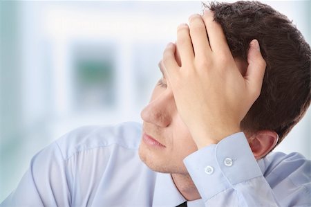 simsearch:400-05363701,k - Businessman in depression with hand on forehead Stock Photo - Budget Royalty-Free & Subscription, Code: 400-04845628
