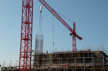 franky242 (artist) - Construction site with red cranes and building Fotografie stock - Microstock e Abbonamento, Codice: 400-04845663