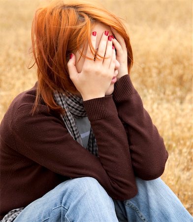 Lonely sad red-haired girl in field Stock Photo - Budget Royalty-Free & Subscription, Code: 400-04845715