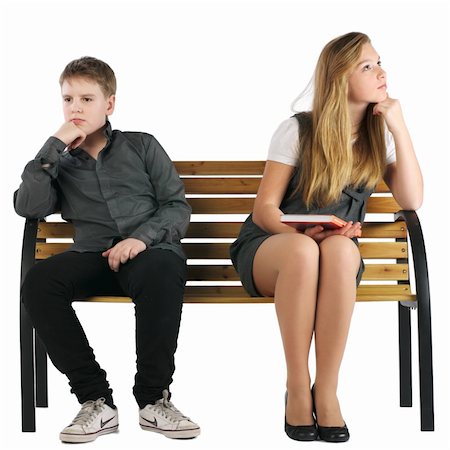 Boy and girl sitting on a bench and not looking at each other Foto de stock - Super Valor sin royalties y Suscripción, Código: 400-04845781