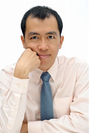 Mature executive of Asian considering and thinking and looking at you, half length closeup portrait on white background. Stock Photo - Budget Royalty-Free & Subscription, Code: 400-04845913