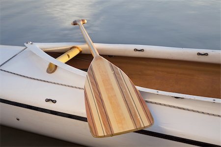 a wooden paddle across cockpit of decked expedition canoe Stock Photo - Budget Royalty-Free & Subscription, Code: 400-04846038