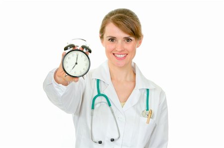 simsearch:400-04351236,k - Smiling medical female doctor holding alarm clock in hand isolated on white Photographie de stock - Aubaine LD & Abonnement, Code: 400-04846104