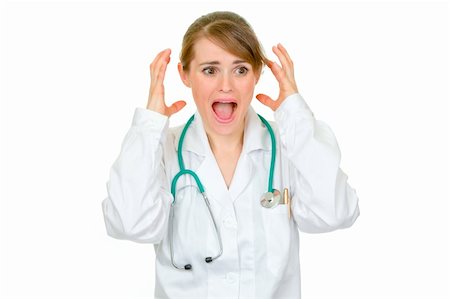 simsearch:400-04351236,k - Shocked medical female doctor holding her hands near head isolated on white Photographie de stock - Aubaine LD & Abonnement, Code: 400-04846100