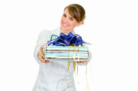 simsearch:400-04351236,k - Smiling medical female doctor holding gift in hands isolated on white Stock Photo - Budget Royalty-Free & Subscription, Code: 400-04846102