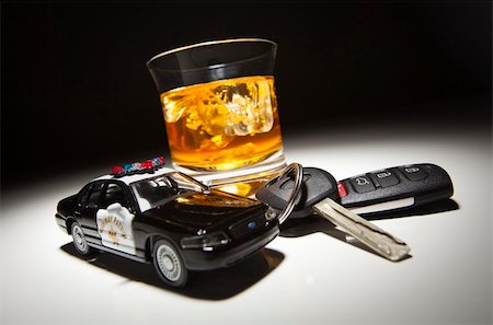 simsearch:400-04947548,k - Highway Patrol Police Car Next to Alcoholic Drink and Keys Under Spot Light. Stock Photo - Budget Royalty-Free & Subscription, Code: 400-04846288