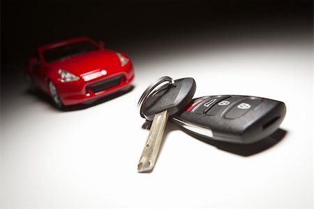 Car Keys and Sports Car Under Spot Light. Stock Photo - Budget Royalty-Free & Subscription, Code: 400-04846293