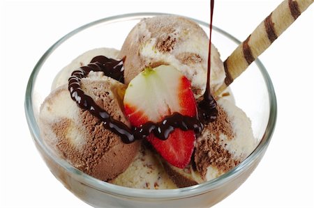 stracciatella - Vanilla and chocolate ice-cream, strawberry and waffle roll with chocolate sauce being poured over (Selective Focus) Stock Photo - Budget Royalty-Free & Subscription, Code: 400-04846747