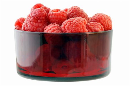 Sweet and delicious raspberries in a vintage red colored glass bowl isolated on white background Stock Photo - Budget Royalty-Free & Subscription, Code: 400-04847637