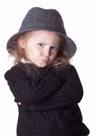 strotter13 (artist) - An isolation of a child on white.  Her lips are pursed and she is very serious.  Way too cool. Photographie de stock - Aubaine LD & Abonnement, Code: 400-04847648