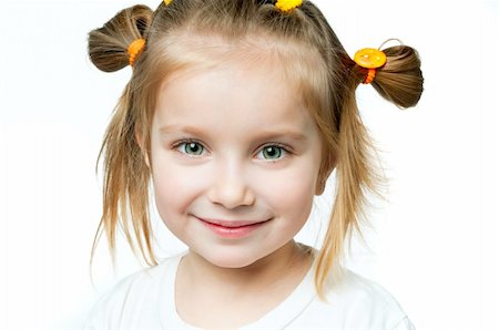 beautiful little girl smiling on a white background Stock Photo - Budget Royalty-Free & Subscription, Code: 400-04847750