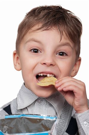 simsearch:400-04979626,k - Portrait of a cute boy eating potato chips - isolated on white Foto de stock - Super Valor sin royalties y Suscripción, Código: 400-04847962