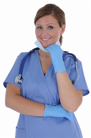 A attractive young female nurse wearing gloves and a mask, isolated on a solid white background. Stock Photo - Budget Royalty-Free & Subscription, Code: 400-04848008