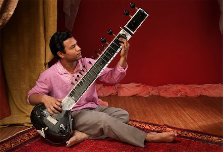 simsearch:400-04848047,k - Handsome young Indian man plays a Sitar Stock Photo - Budget Royalty-Free & Subscription, Code: 400-04848047