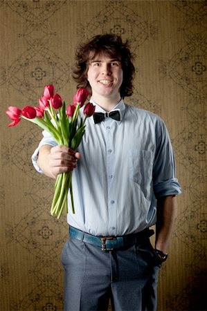 An image of handsome man with red tulips Stock Photo - Budget Royalty-Free & Subscription, Code: 400-04848281