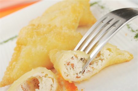 simsearch:400-05324780,k - Appetizer: Empanada de Queso de Cabra (Pasty filled with goat cheese) cut in half with fork (Selective Focus) Photographie de stock - Aubaine LD & Abonnement, Code: 400-04848668