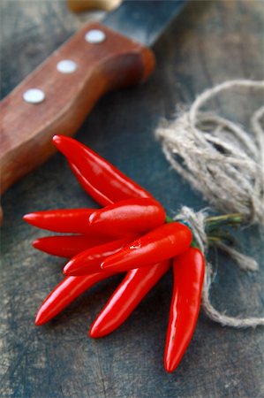 simsearch:400-05751294,k - Red hot chili peppers over wooden background Foto de stock - Super Valor sin royalties y Suscripción, Código: 400-04848949