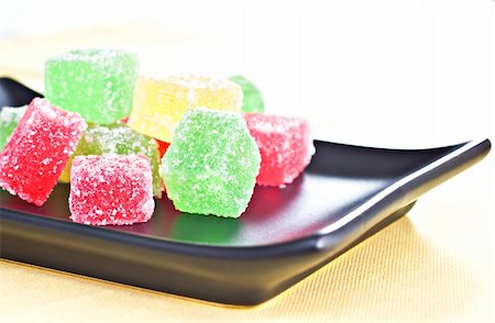 Marmalade candy on a dark plate. Fotografie stock - Microstock e Abbonamento, Codice: 400-04849199