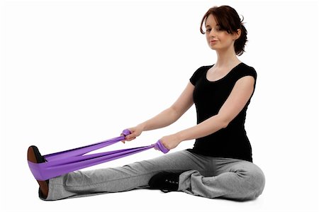 young woman sitting on floor exercising gymastics with a purple ribbon Stock Photo - Budget Royalty-Free & Subscription, Code: 400-04840002