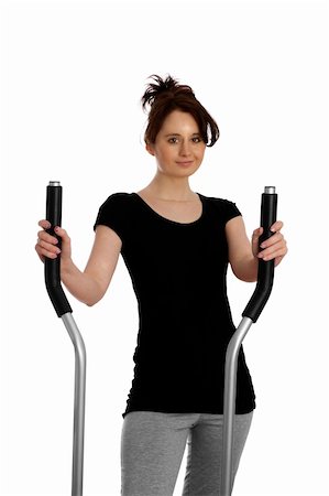 simsearch:400-05062836,k - young woman exercising on stepping machine Stock Photo - Budget Royalty-Free & Subscription, Code: 400-04840003