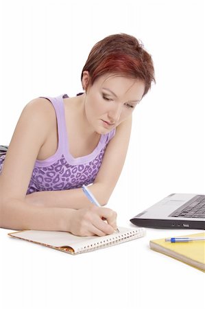 simsearch:400-05668910,k - Girl doing her homework on white background. Stock Photo - Budget Royalty-Free & Subscription, Code: 400-04840221