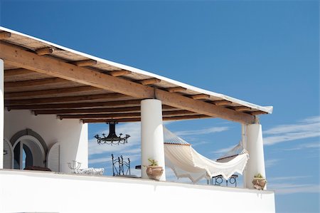 fluttuazione - sunlit balcony with hammock Fotografie stock - Microstock e Abbonamento, Codice: 400-04840302