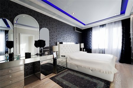 beautiful and modern bedroom with mirrored furniture Fotografie stock - Microstock e Abbonamento, Codice: 400-04840463
