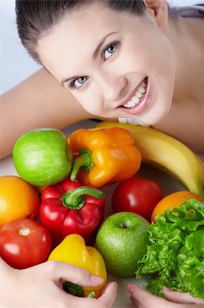 pretty women eating banana - Attractive young girl with fruits and vegetables Photographie de stock - Aubaine LD & Abonnement, Code: 400-04840763