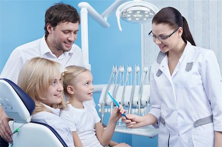 dentist, family - Dentist gives the child a toothbrush in the dental office Stock Photo - Budget Royalty-Free & Subscription, Code: 400-04840770