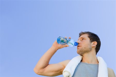 simsearch:400-05104948,k - Man drinking water after the gym Stock Photo - Budget Royalty-Free & Subscription, Code: 400-04841227