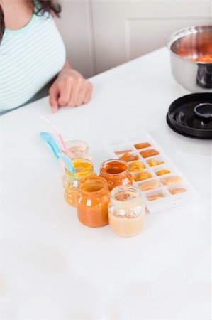 simsearch:400-05320841,k - Close-up of a mother preparing food for her baby in the kitchen at home Stock Photo - Budget Royalty-Free & Subscription, Code: 400-04841269