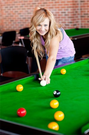 Bright woman playing pool in a club Stock Photo - Budget Royalty-Free & Subscription, Code: 400-04841515