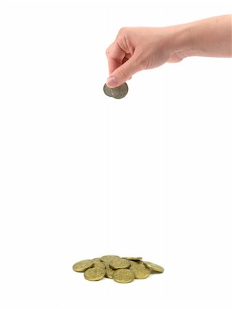 A female hand dropping coin isolated against a white background Photographie de stock - Aubaine LD & Abonnement, Code: 400-04841520