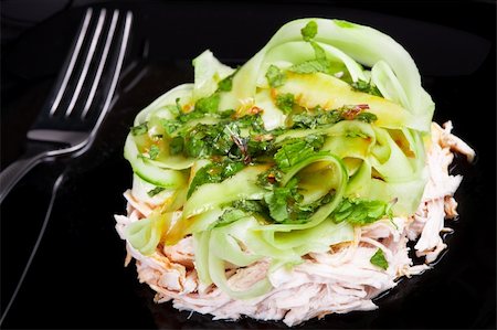 side dish with chicken - Vitamin salad with lime in the black dish Stock Photo - Budget Royalty-Free & Subscription, Code: 400-04841647