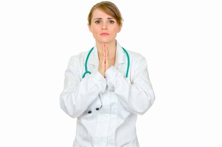 simsearch:400-04351236,k - Young medical doctor woman praying for success isolated on white Photographie de stock - Aubaine LD & Abonnement, Code: 400-04842474