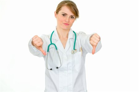 simsearch:400-04351236,k - Displeased medical doctor woman showing thumbs down gesture isolated on white Photographie de stock - Aubaine LD & Abonnement, Code: 400-04842475